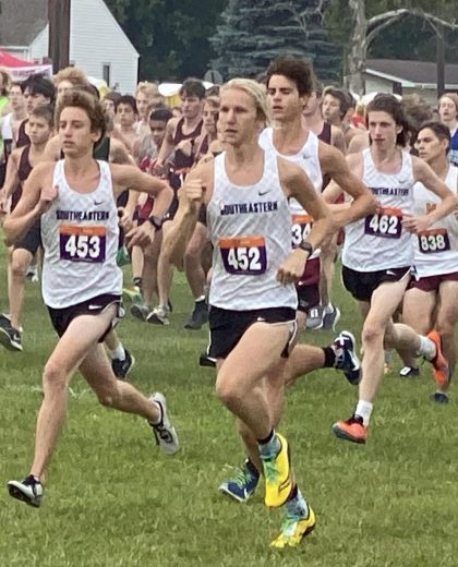 Eyes ahead, senior Luke Andritsch races against other students during a Cross Country meet. 