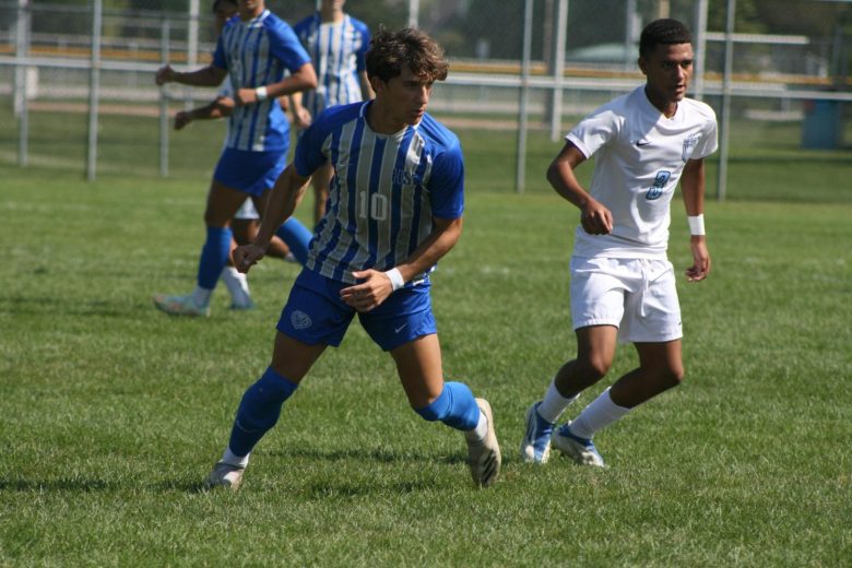 Head on a swivel to the left, junior Evan Shideler #10, who is one of the three captains of the HSE boys varsity soccer team. 
