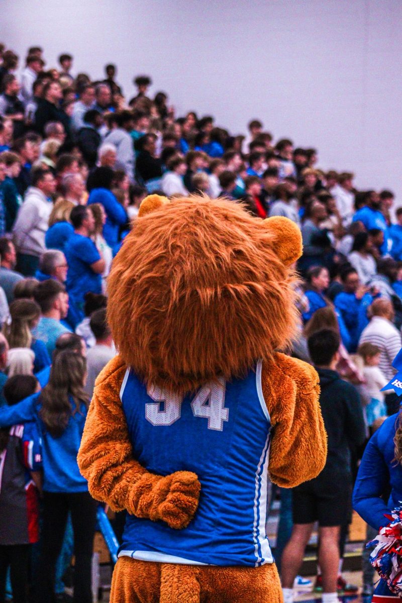 HSEs mascot Roary listening to the Star-Spangled Banner