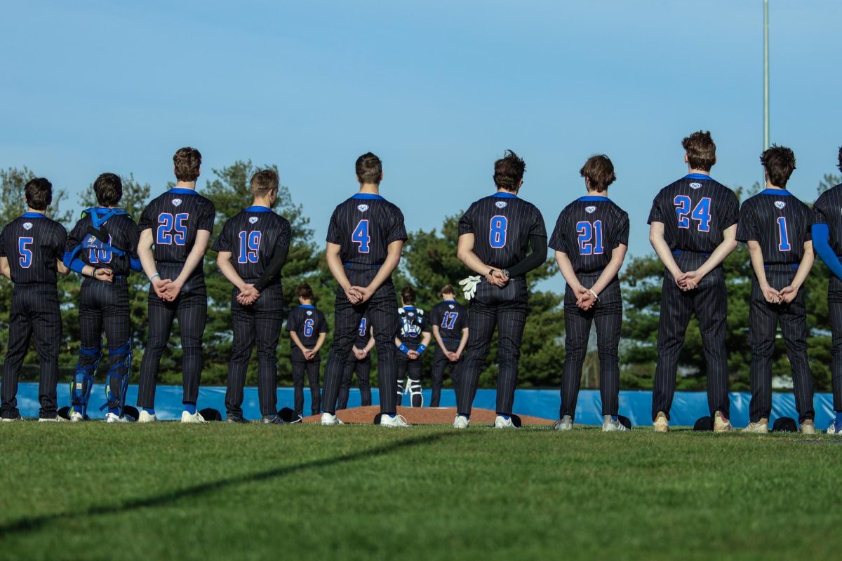 HSE Baseball Stands in Unity for the National Anthem Before the Game